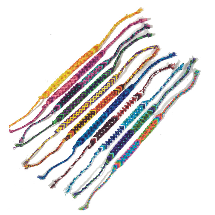 Set of colorful braided bracelets on a white background