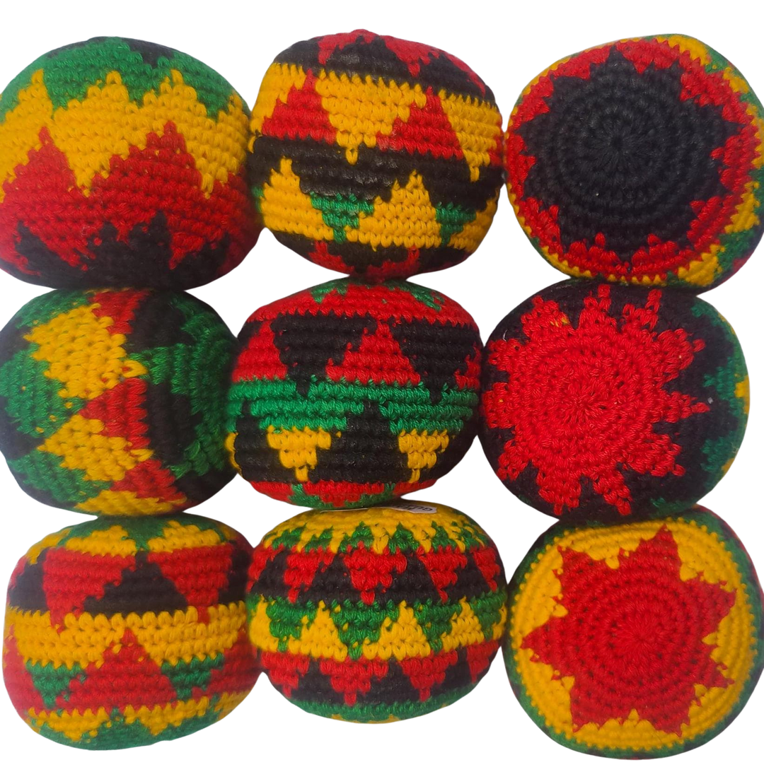 Colorful crocheted footbag hacky sacks in rasta colors geometric patterns on a white background