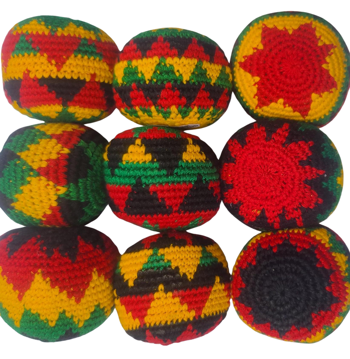 Colorful crocheted balls with geometric patterns on a white background