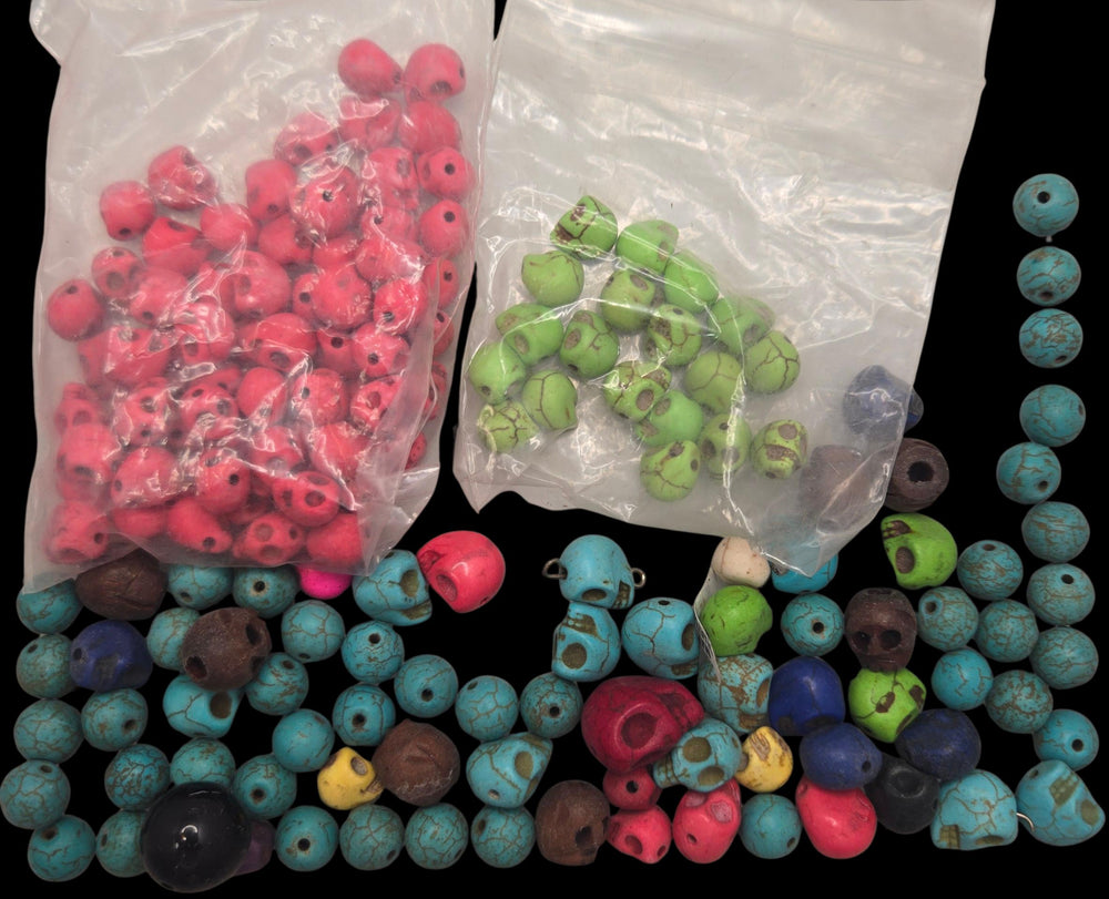 Loose and bagged small skull beads in pink, green, turquoise and black, a mixed color bead lot, bulk skull beads